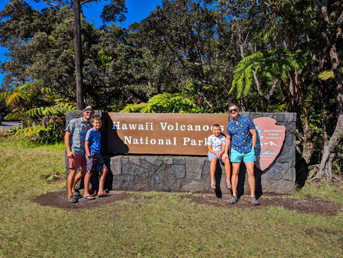 Full Taylor Family at Entrance Sign Hawaii Volcanoes National Park Big Island Hawaii 1