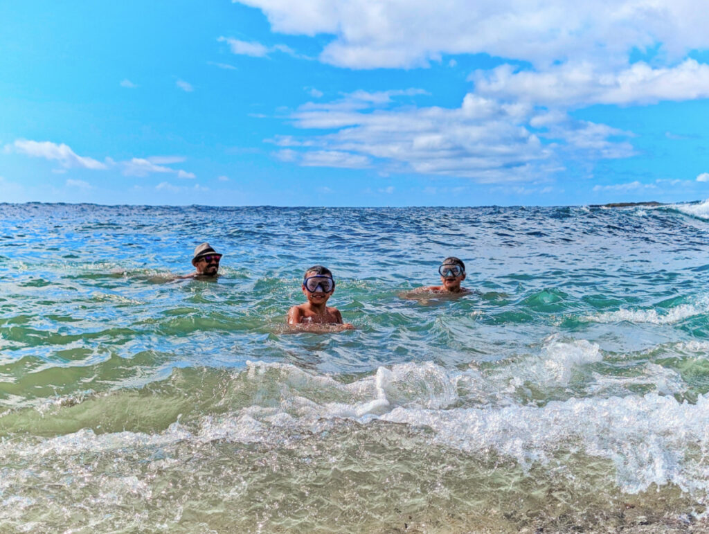 Taylor Family swimming at Glass Beach Port Allen South Shore Kauai Hawaii 2