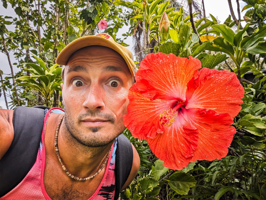 Rob Taylor with giant hibiscus at Garden of Eden Arboretum Road to Hana Maui Hawaii 2