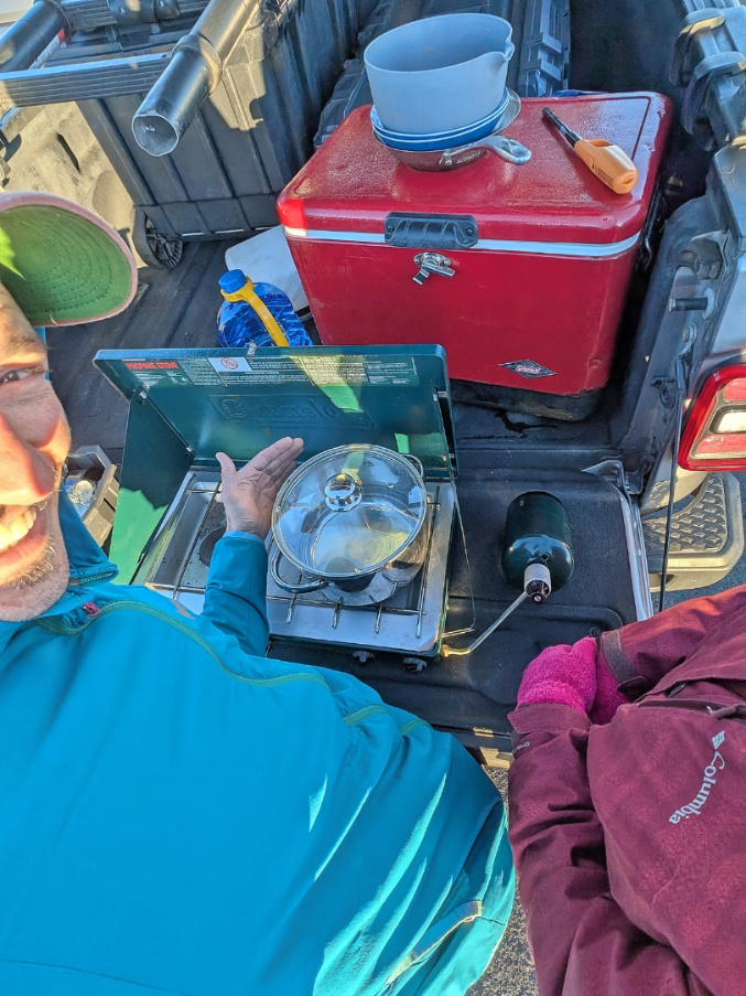 Making breakfast on camp stove Jeep camping at Haleakala National Park Maui Hawaii 1