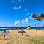 Surfers at Poipu Beach Koloa South Shore Kauai Hawaii 1