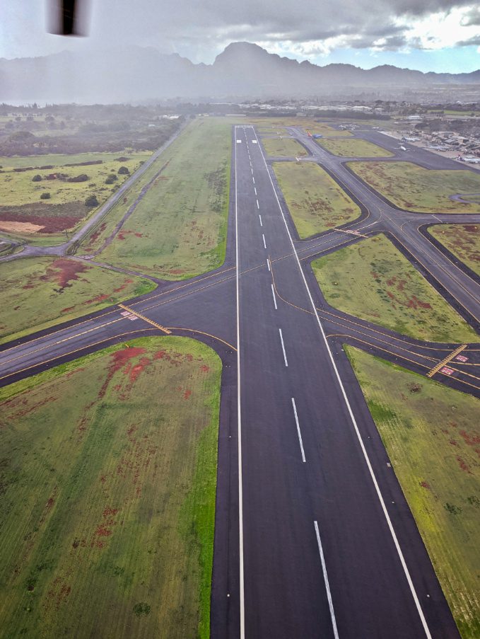 Flying into Rain over Lihue Airport with Air Kauai Doors Off Helicopter Tour Kauai Hawaii