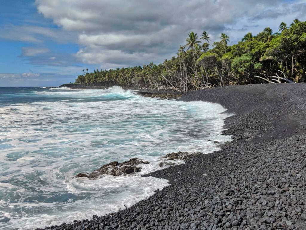 Waves crashing at Pohoiki Black Sand Beach Isaac Hale Park Hilo Big Island Hawaii